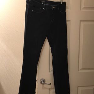 White House Black Market Flare dark denim jeans .